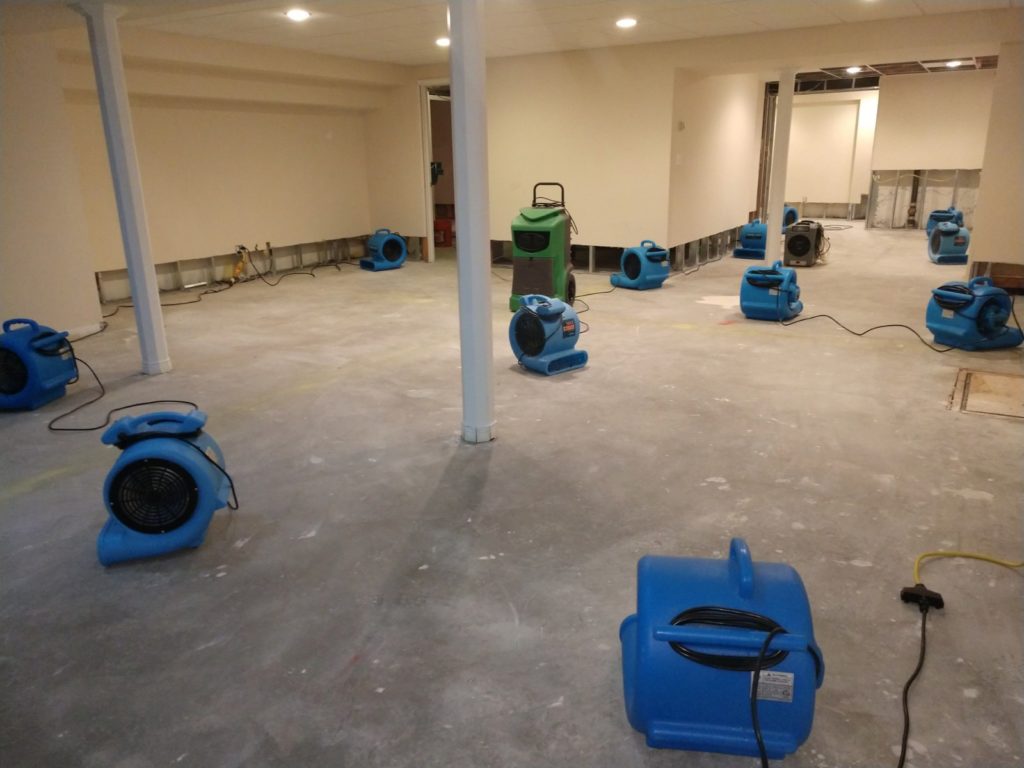 Drying out a water damaged basement.