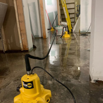 Extracting water from a flooded basement.