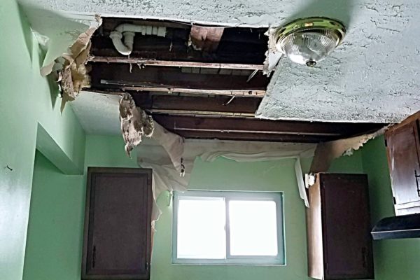 Damaged kitchen ceiling due to water leak.