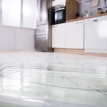 Flooded kitchen due to a water leak.