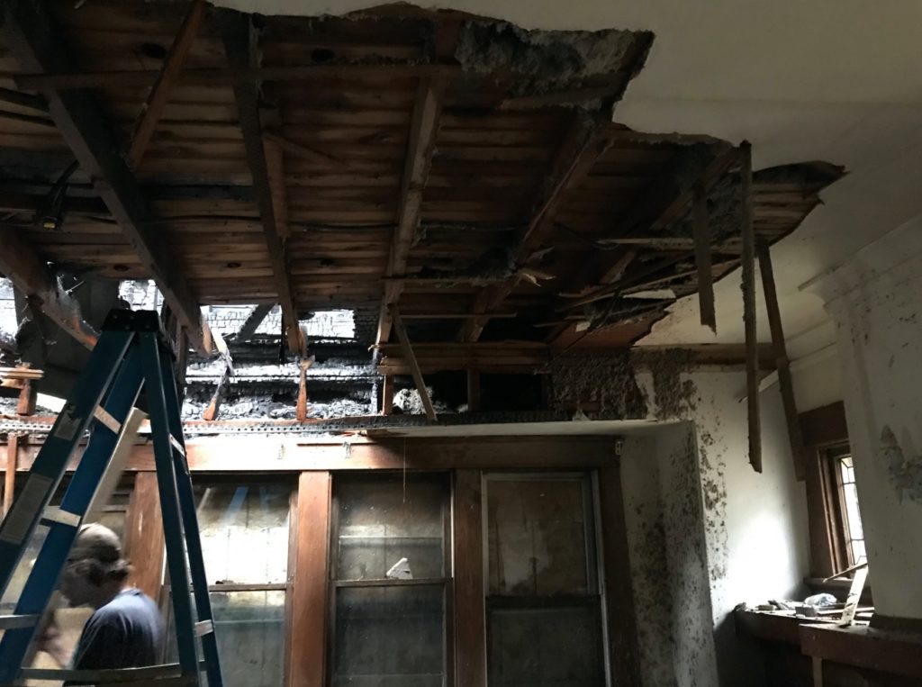 Professionals doing a residential fire damage repair.