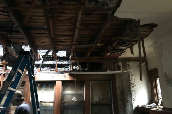 Professionals doing a residential fire damage repair.