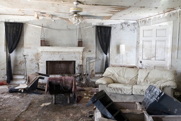 A strong storm damaged a home's living room.