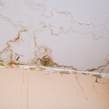 A severely water stained dry wall.